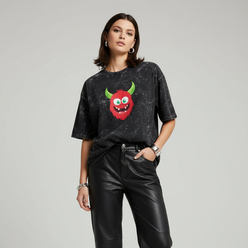 Black distressed t-shirt with a red monster graphic on a white background
