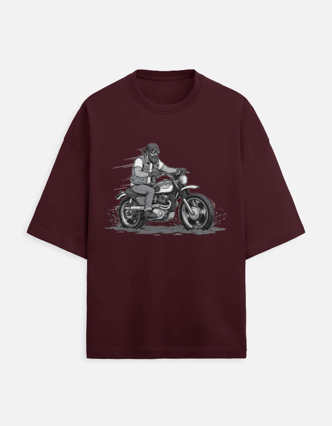 Maroon t-shirt with a graphic of a person on a motorcycle on a white background