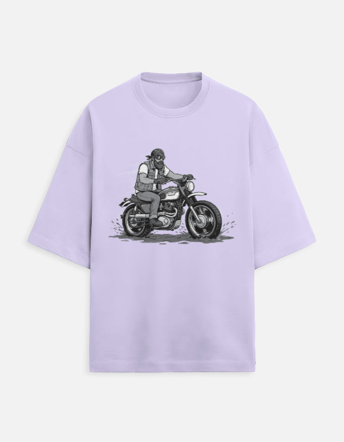 Lavender t-shirt with a graphic of a person on a motorcycle on a white background