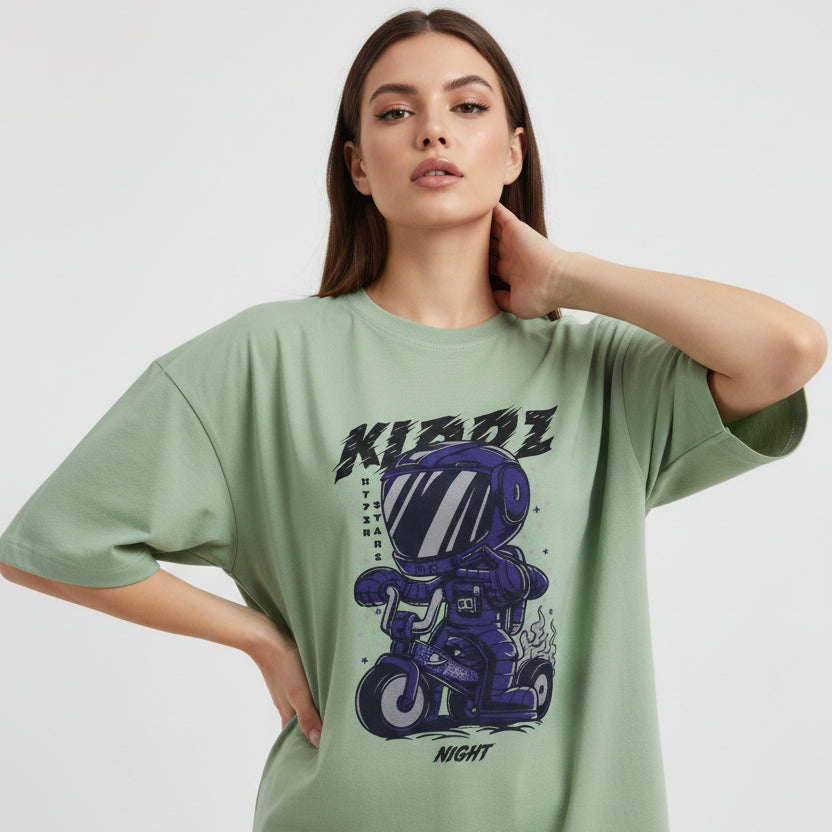 Woman wearing a green t-shirt with a graphic design on a white background