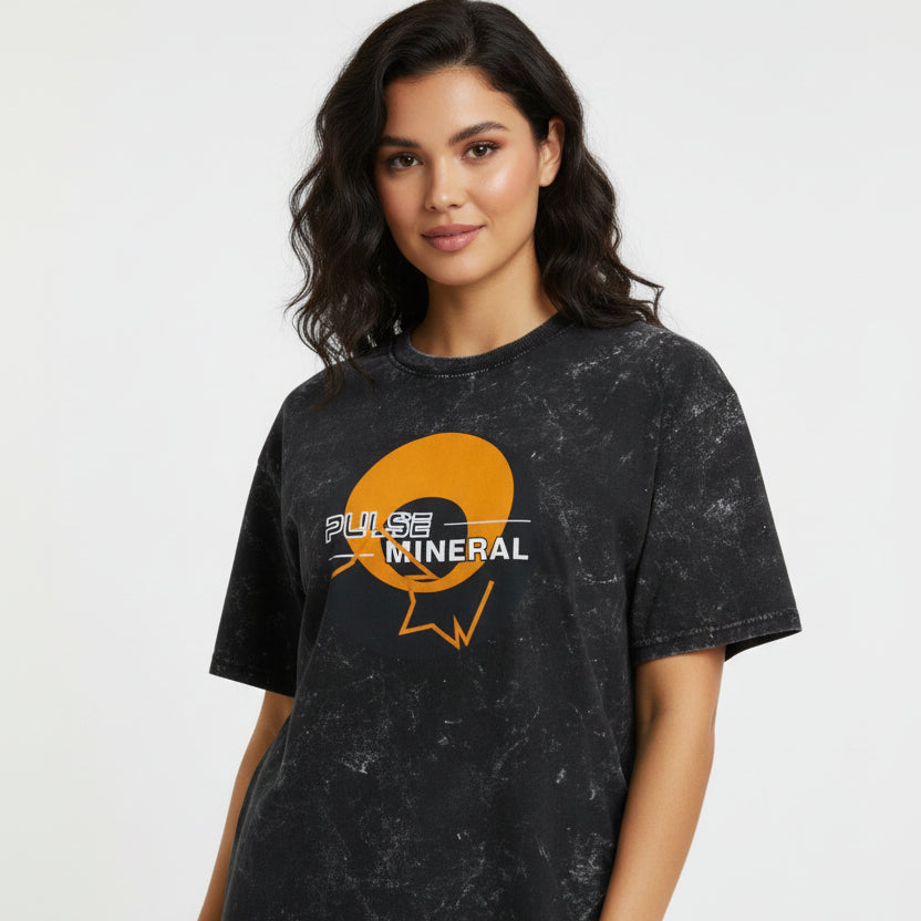 Woman wearing a black t-shirt with 'Pulse Mineral' logo on a white background