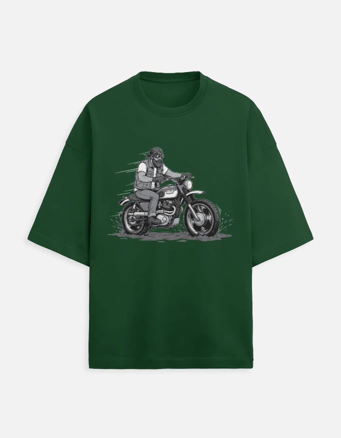 Green t-shirt with a graphic of a person on a motorcycle on a white background