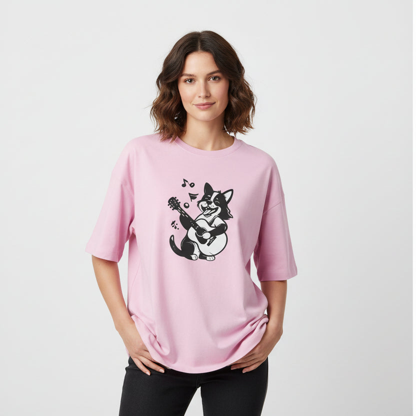 Woman wearing a pink t-shirt with a black and white graphic design on a light gray background